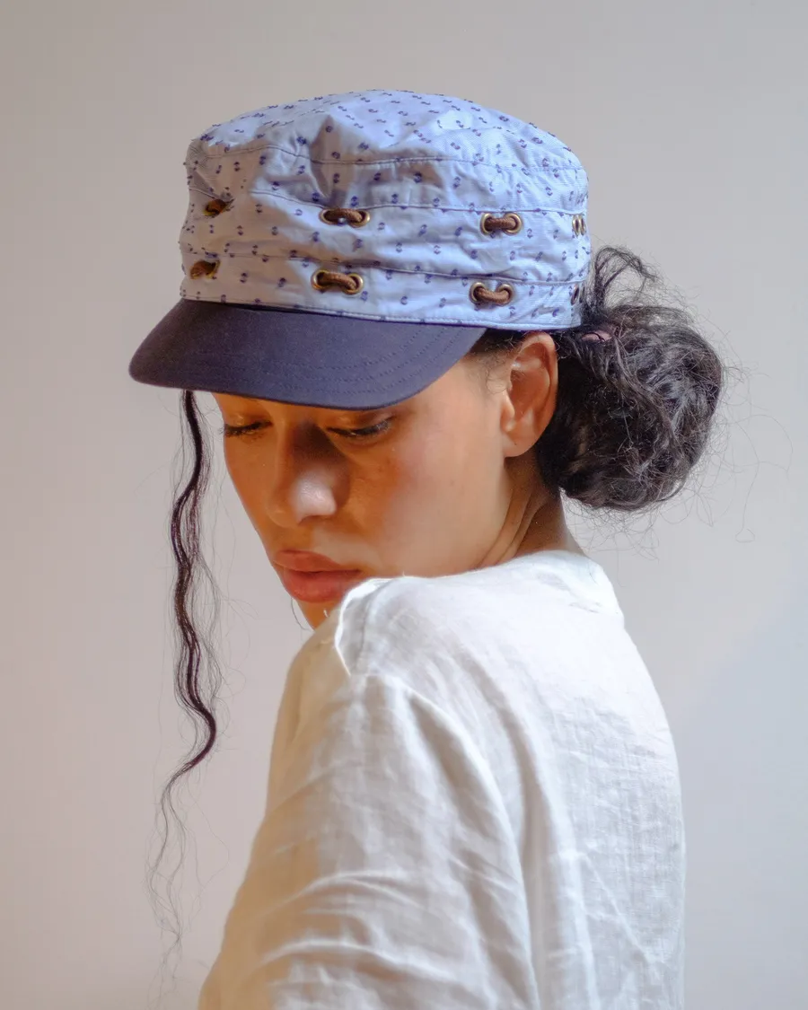 Cap with the visor attached at the front